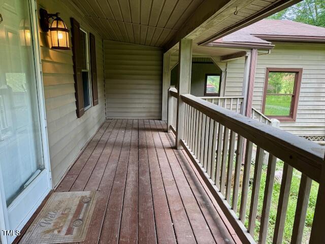 4254 Bowmantown Road Roxboro, NC 27574 - Photo 4 of 23 a view of balcony with wooden floor