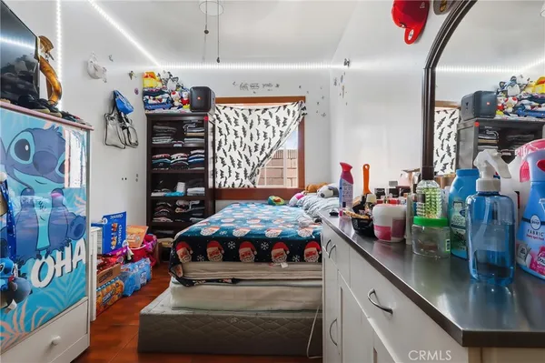 a bedroom with furniture and a window