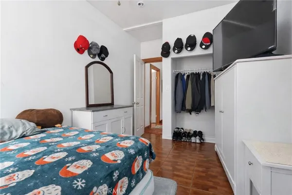 a bedroom with a bed and a dresser