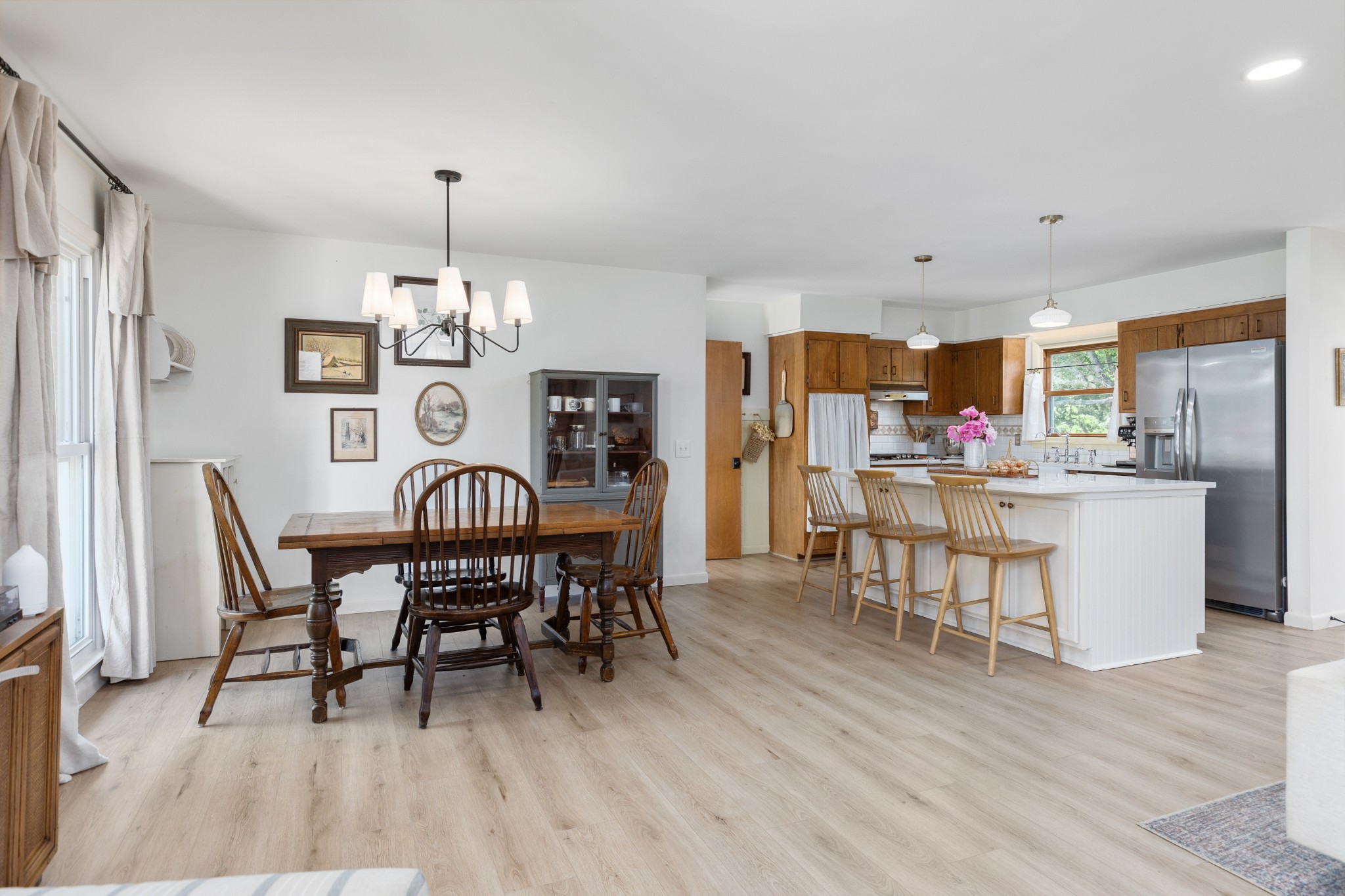 817 Fredricksburg Road Mount Juliet, TN 37122 - Photo 16 of 56 a dining room with furniture a chandelier and wooden floor