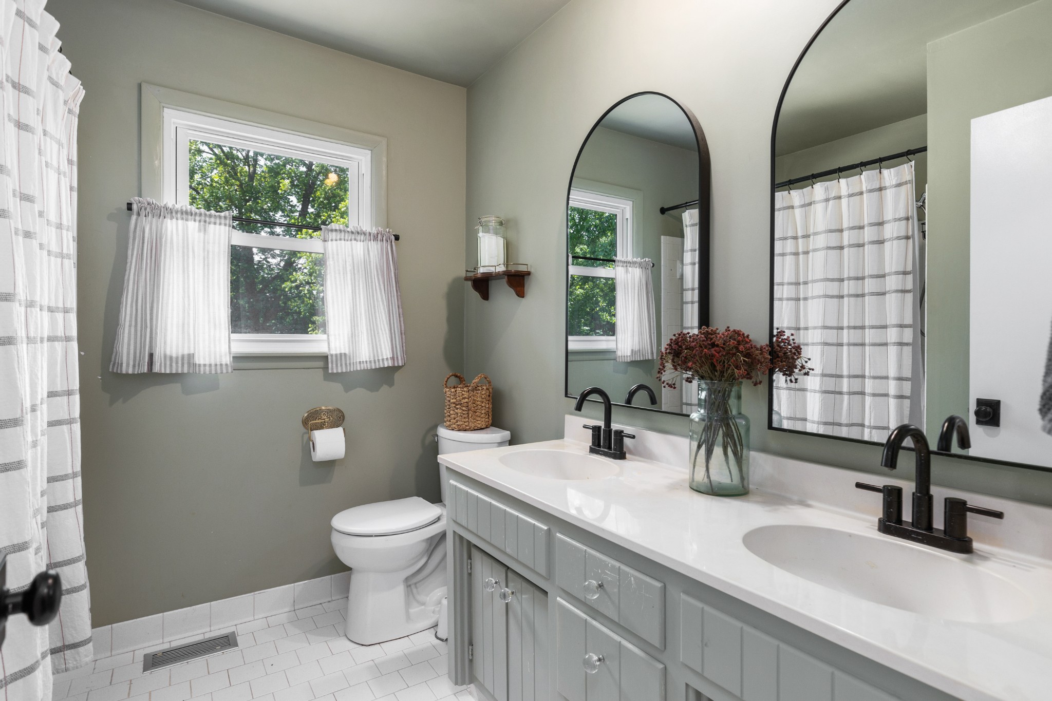 817 Fredricksburg Road Mount Juliet, TN 37122 - Photo 28 of 56 a bathroom with a double vanity sink toilet and a mirror
