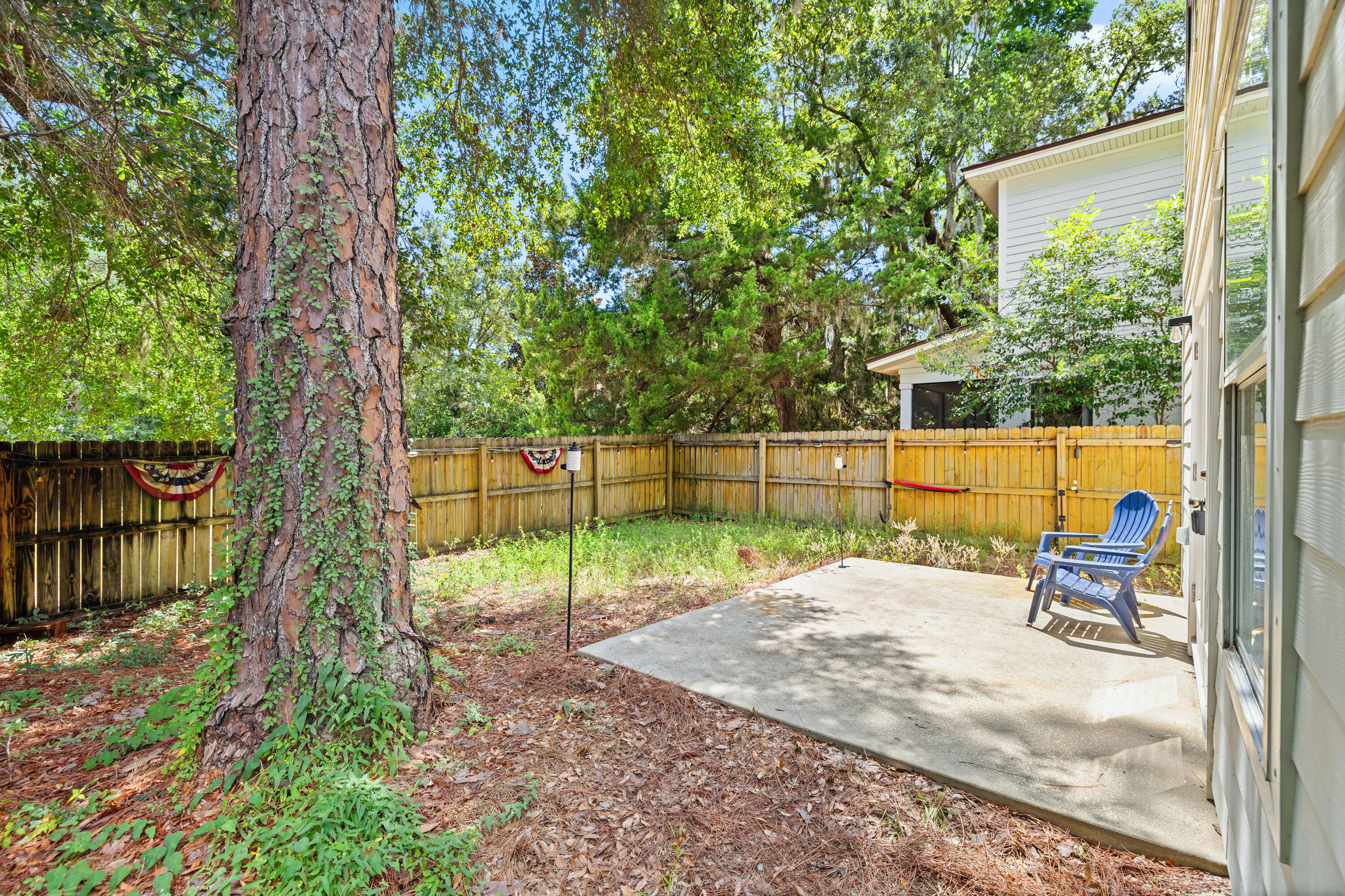 62 Beacon Point Drive Santa Rosa Beach, FL 32459 - Photo 17 of 51 a view of a park with large trees and a wooden fence