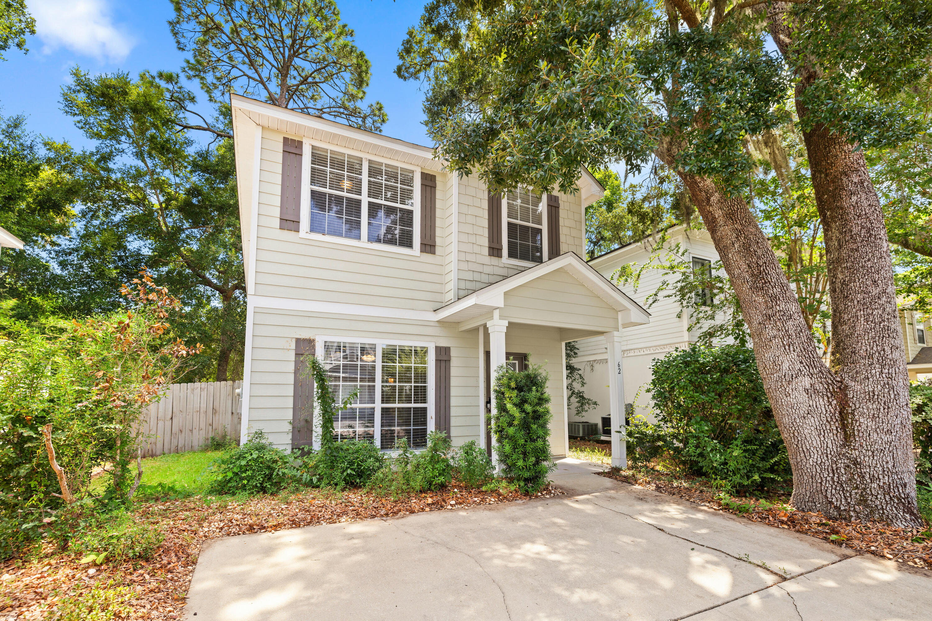 62 Beacon Point Drive Santa Rosa Beach, FL 32459 - Photo 2 of 51 a front view of a house with garden