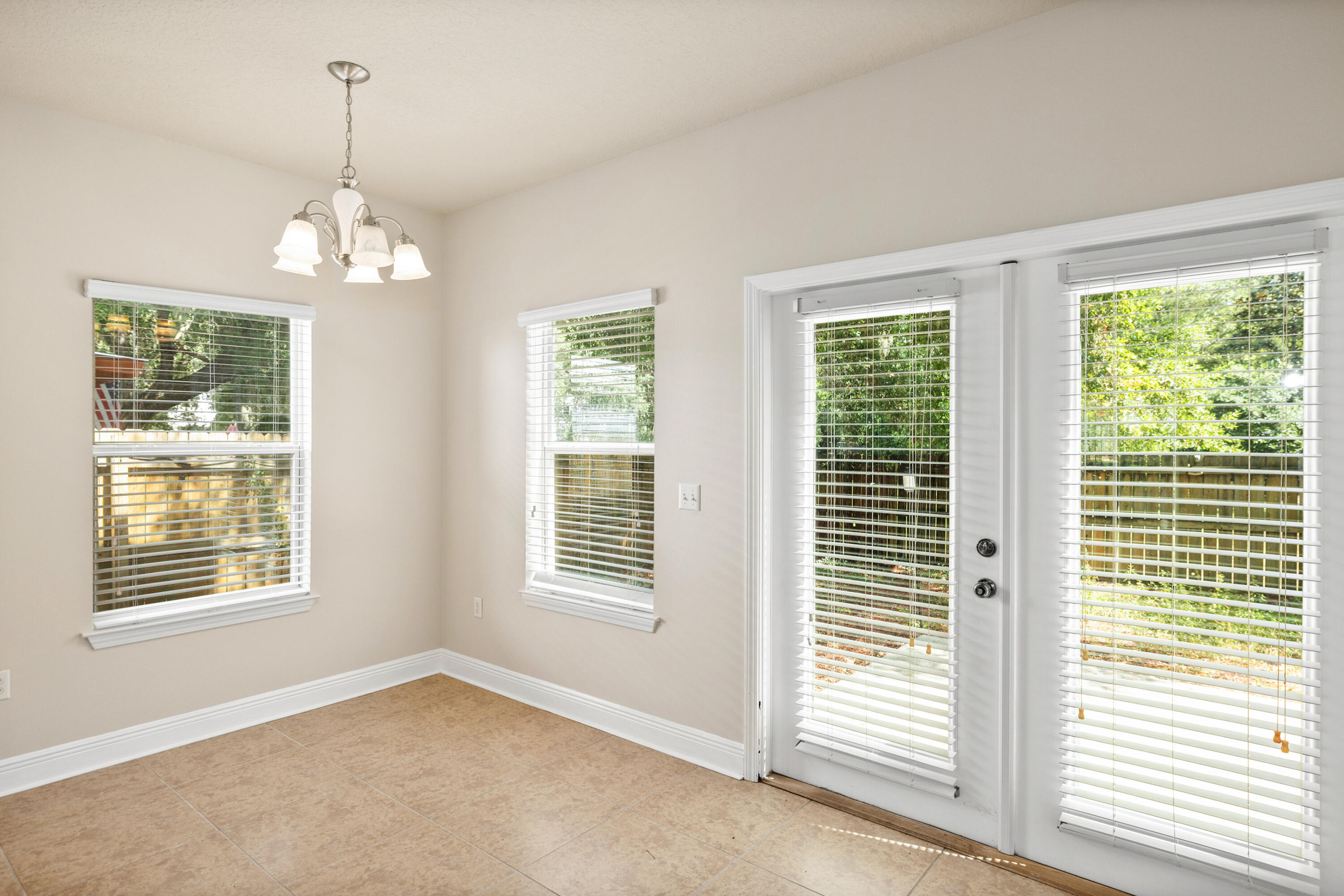 62 Beacon Point Drive Santa Rosa Beach, FL 32459 - Photo 26 of 51 wooden floor in an empty room with a window
