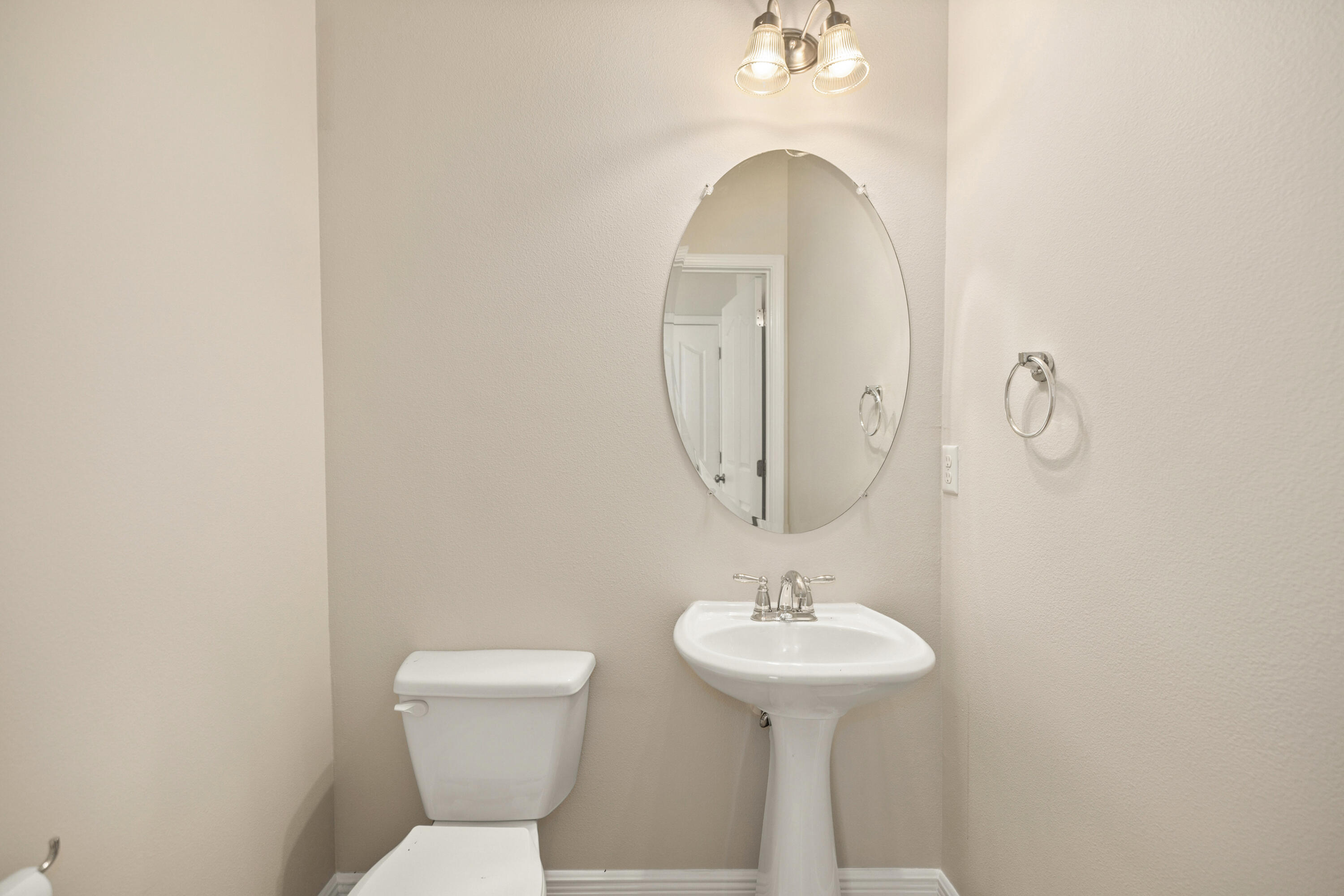 62 Beacon Point Drive Santa Rosa Beach, FL 32459 - Photo 32 of 51 a bathroom with a toilet sink and mirror