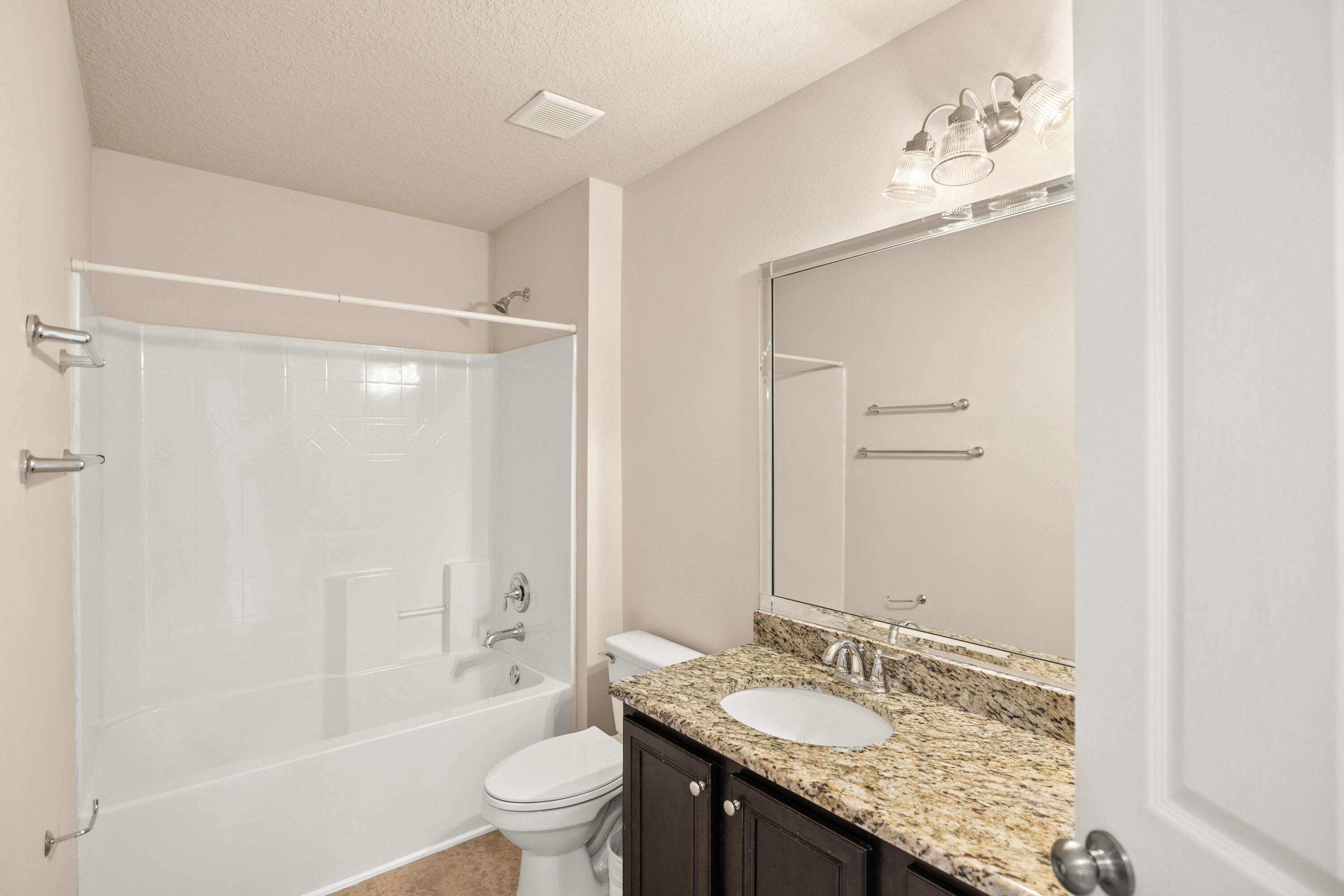 62 Beacon Point Drive Santa Rosa Beach, FL 32459 - Photo 42 of 51 a bathroom with a granite countertop sink a toilet and shower