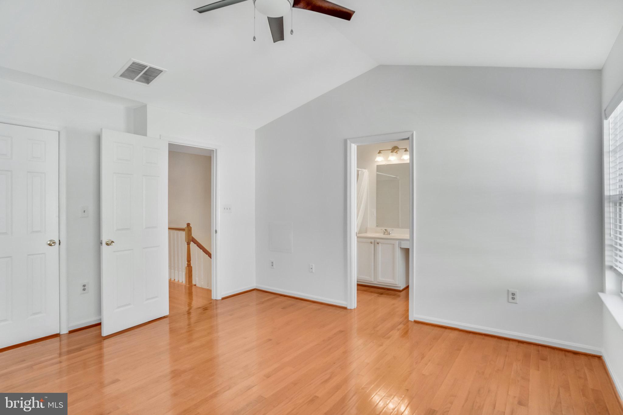6324 Dakine Circle Springfield, VA 22150 - Photo 16 of 25 an empty room with wooden floor and window