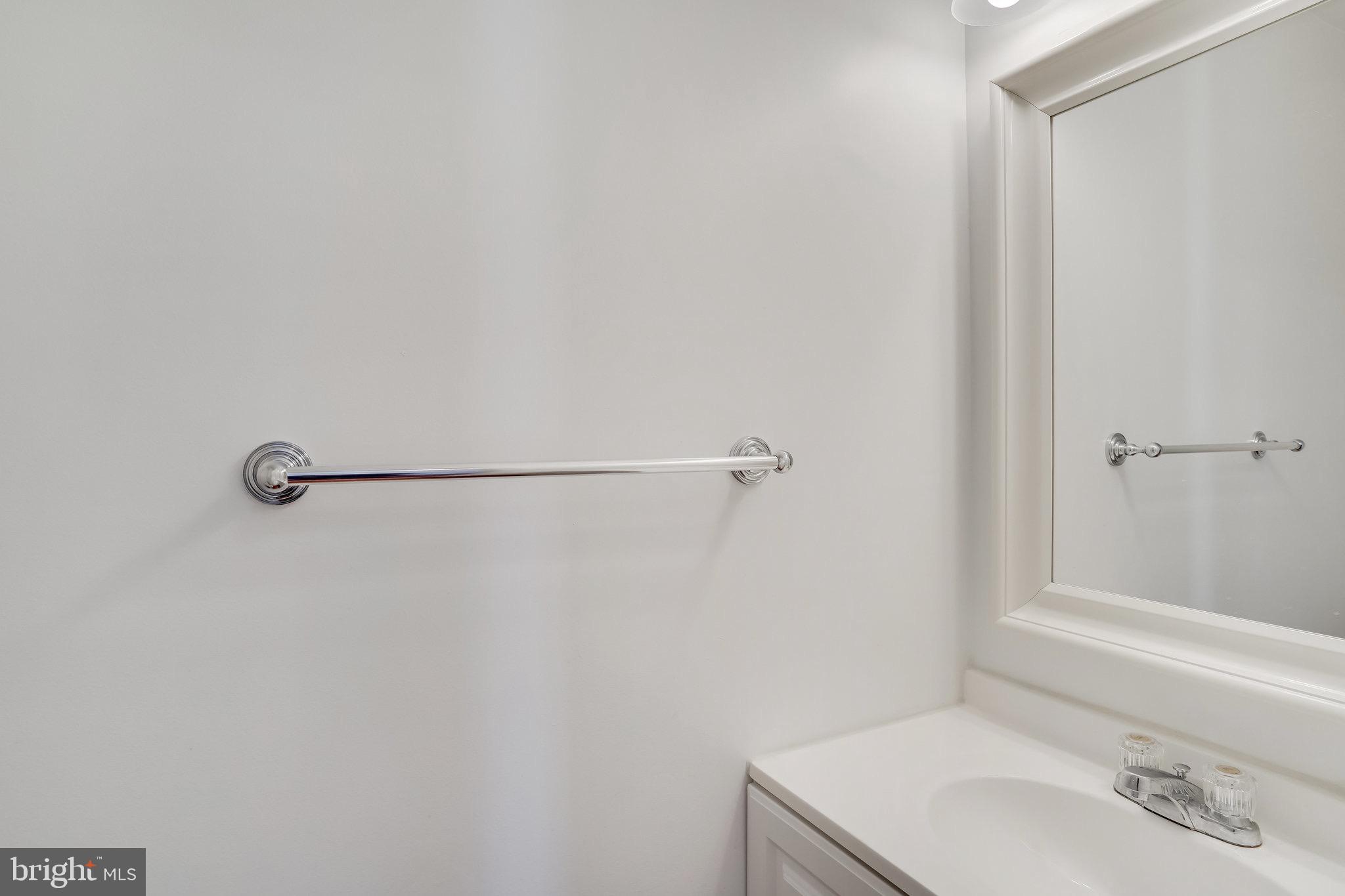 6324 Dakine Circle Springfield, VA 22150 - Photo 3 of 25 a bathroom with a sink and a mirror