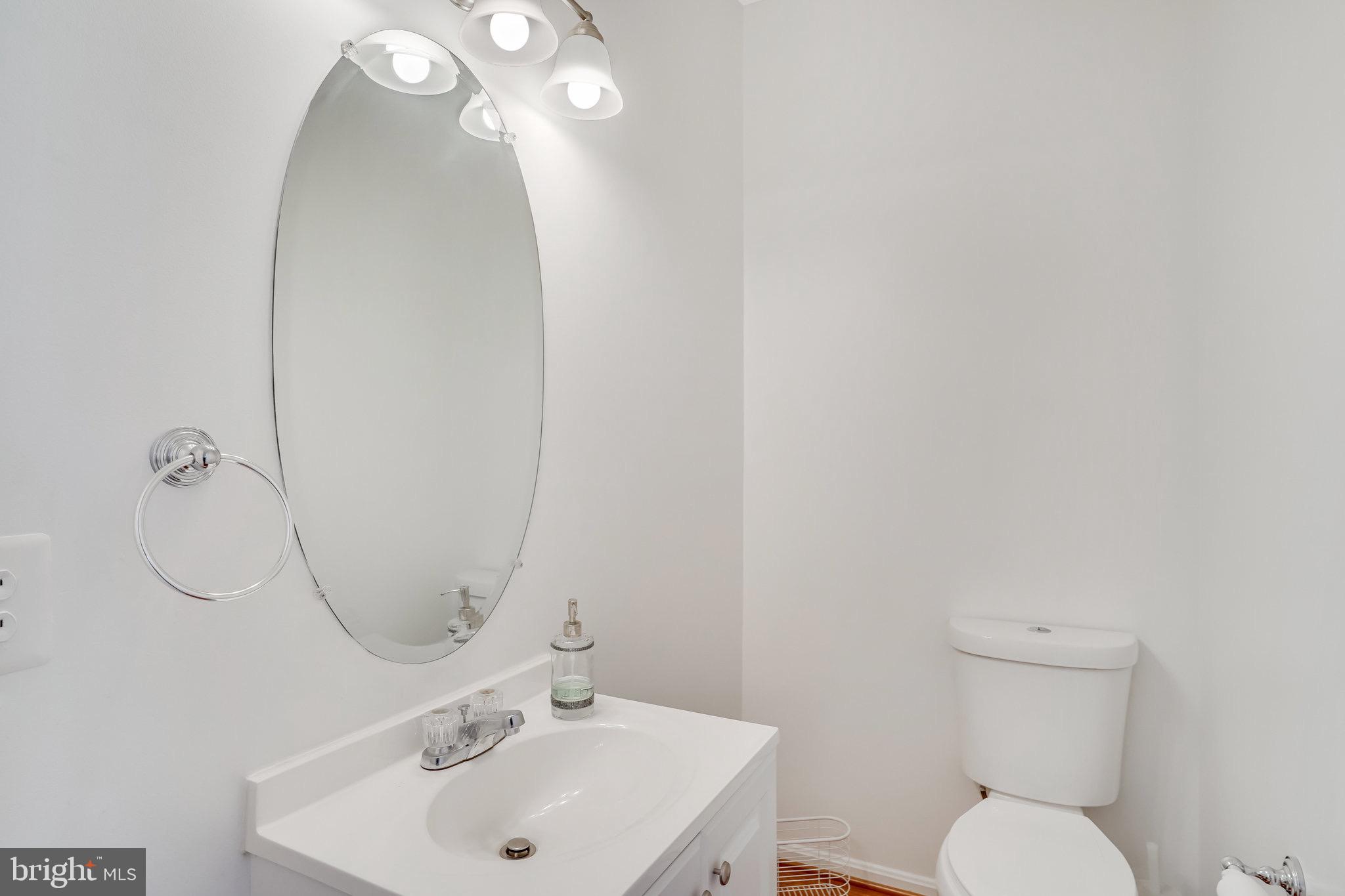 6324 Dakine Circle Springfield, VA 22150 - Photo 10 of 25 a bathroom with a toilet sink and mirror