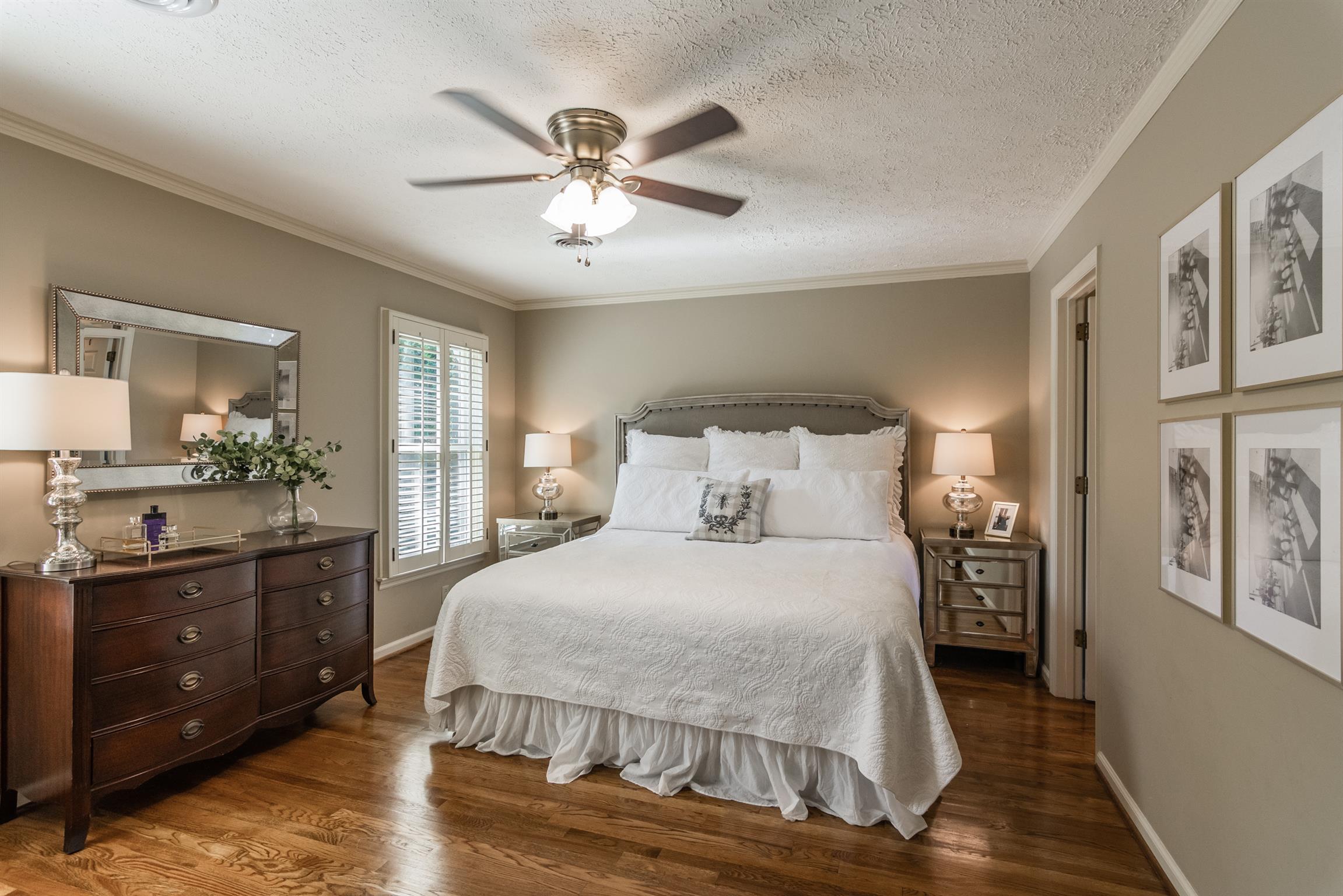 103 Crosspointe Hendersonville, TN 37075 - Photo 16 of 30 a bedroom with a large bed and a chandelier