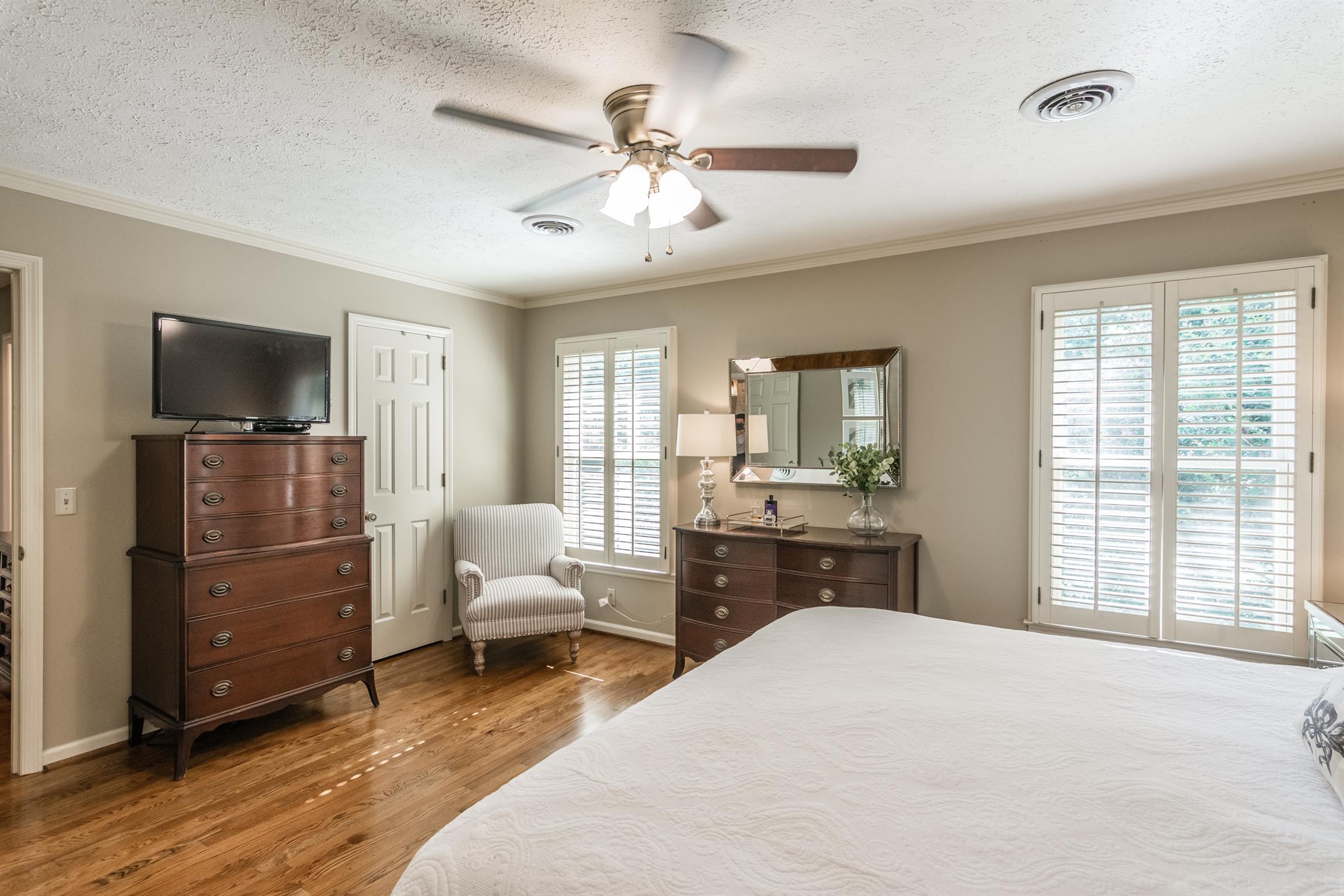 103 Crosspointe Hendersonville, TN 37075 - Photo 18 of 30 a bedroom with a bed and wooden floor