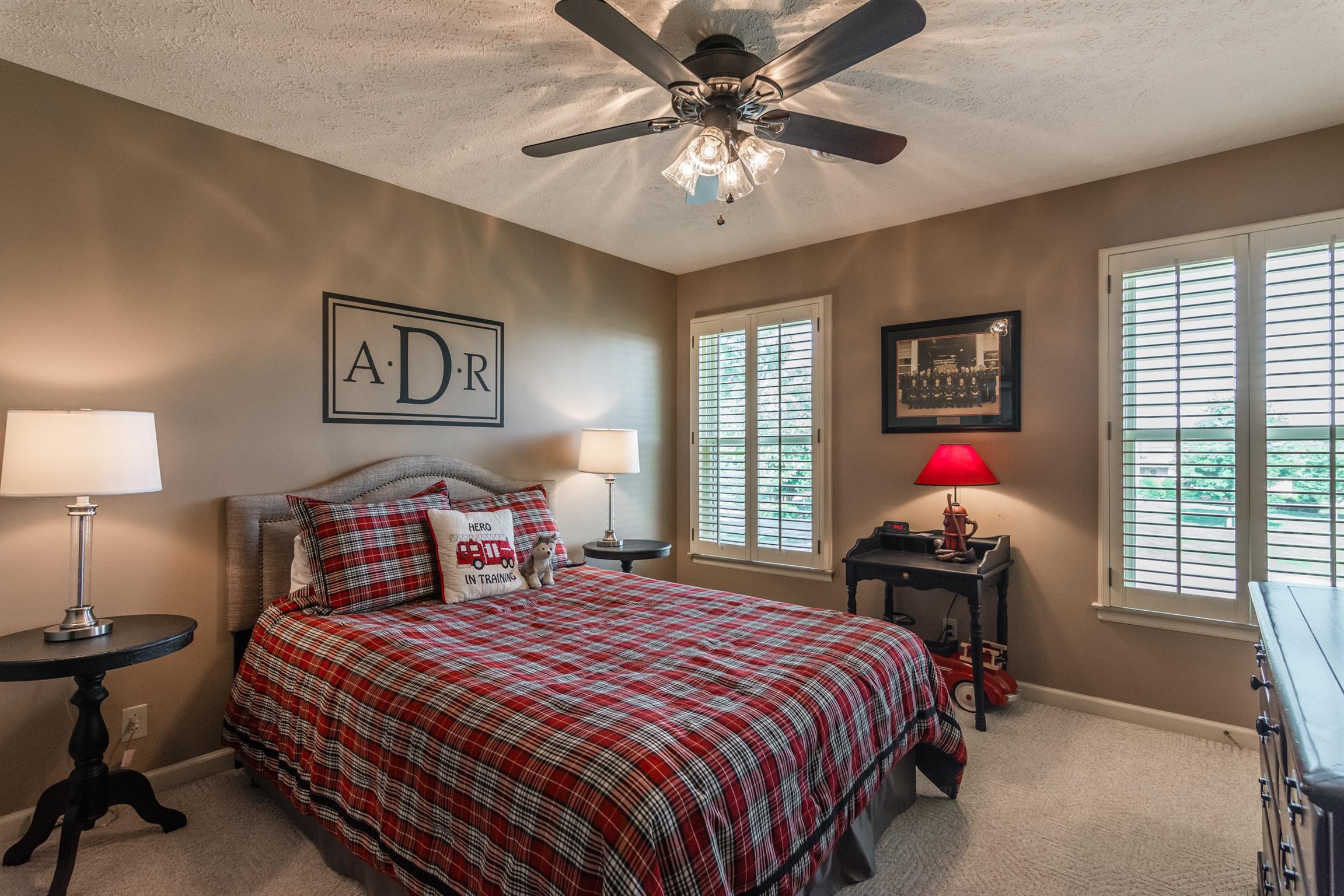 103 Crosspointe Hendersonville, TN 37075 - Photo 22 of 30 a bedroom with a bed and a chandelier