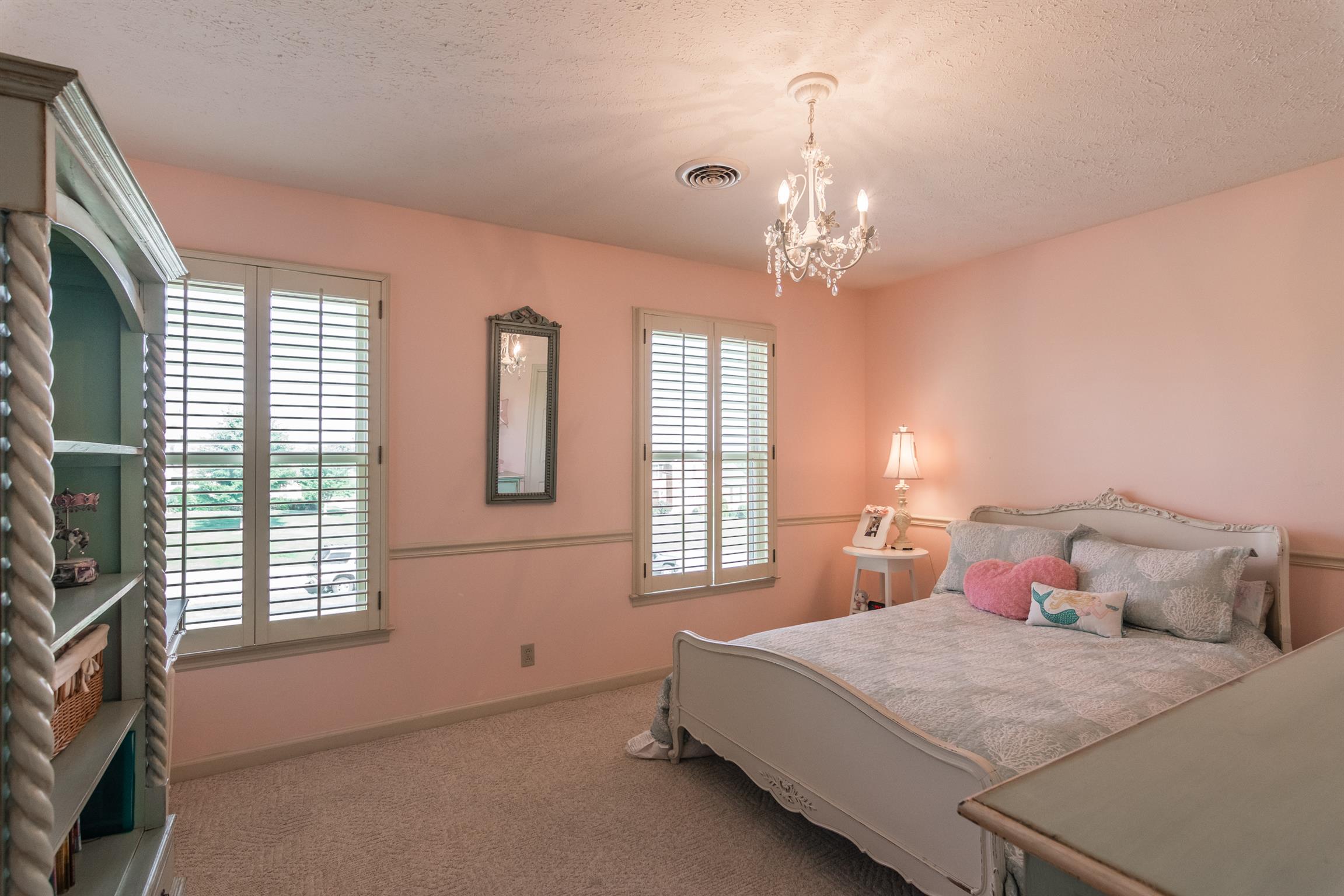 103 Crosspointe Hendersonville, TN 37075 - Photo 23 of 30 a spacious bedroom with a bed and a flat screen tv