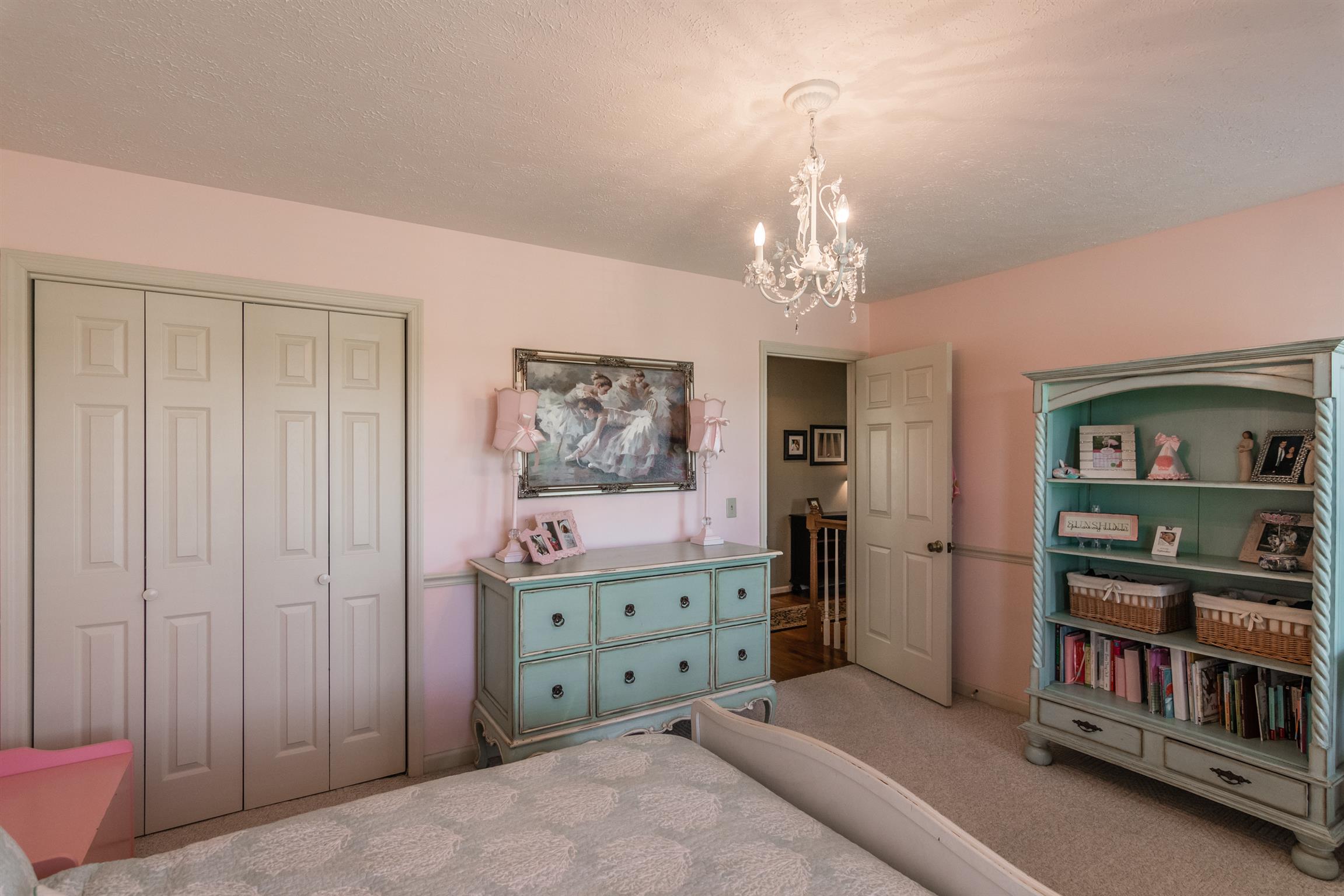 103 Crosspointe Hendersonville, TN 37075 - Photo 24 of 30 a spacious bedroom with a bed and a book shelf