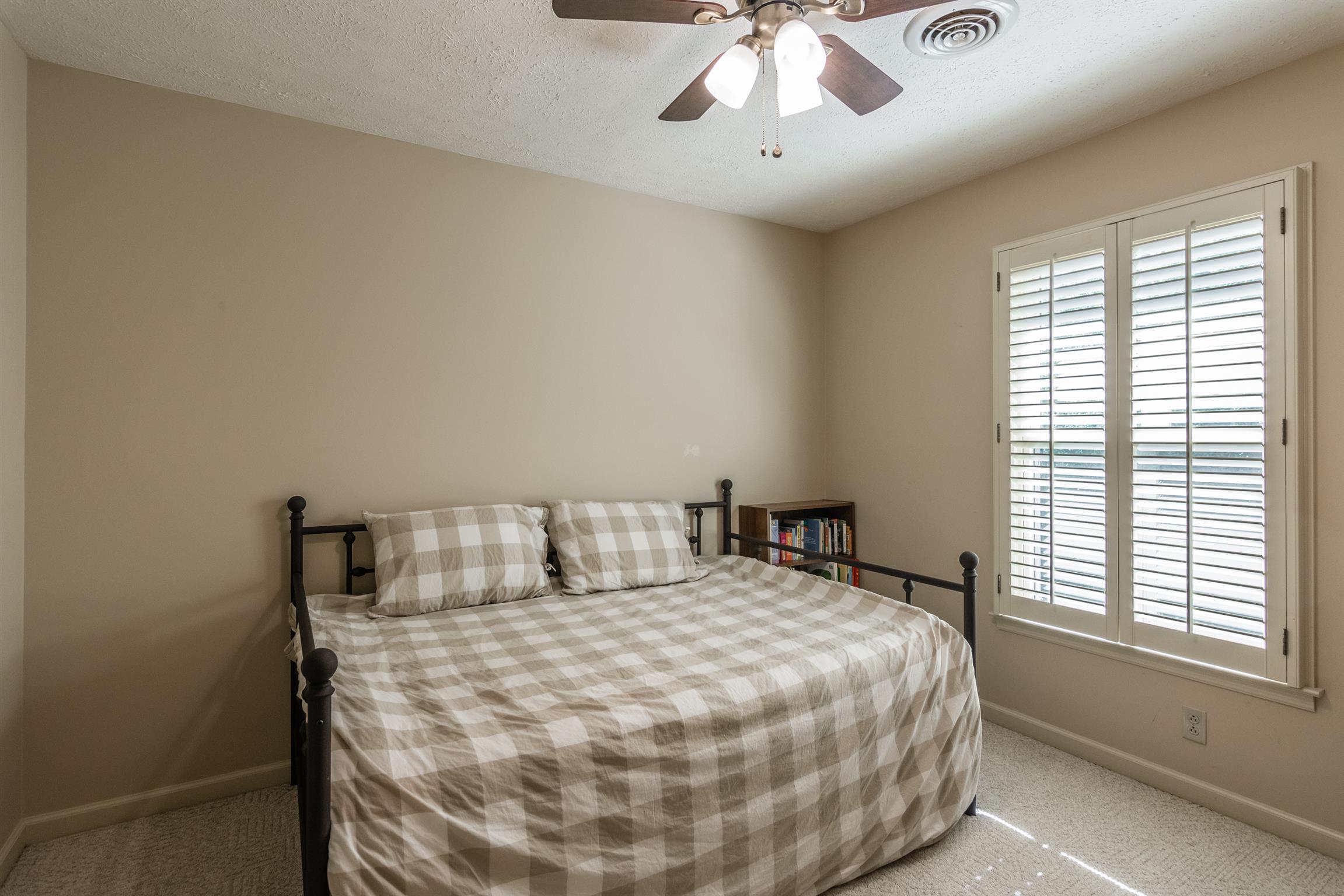 103 Crosspointe Hendersonville, TN 37075 - Photo 25 of 30 a large bed sitting in a bedroom next to a window
