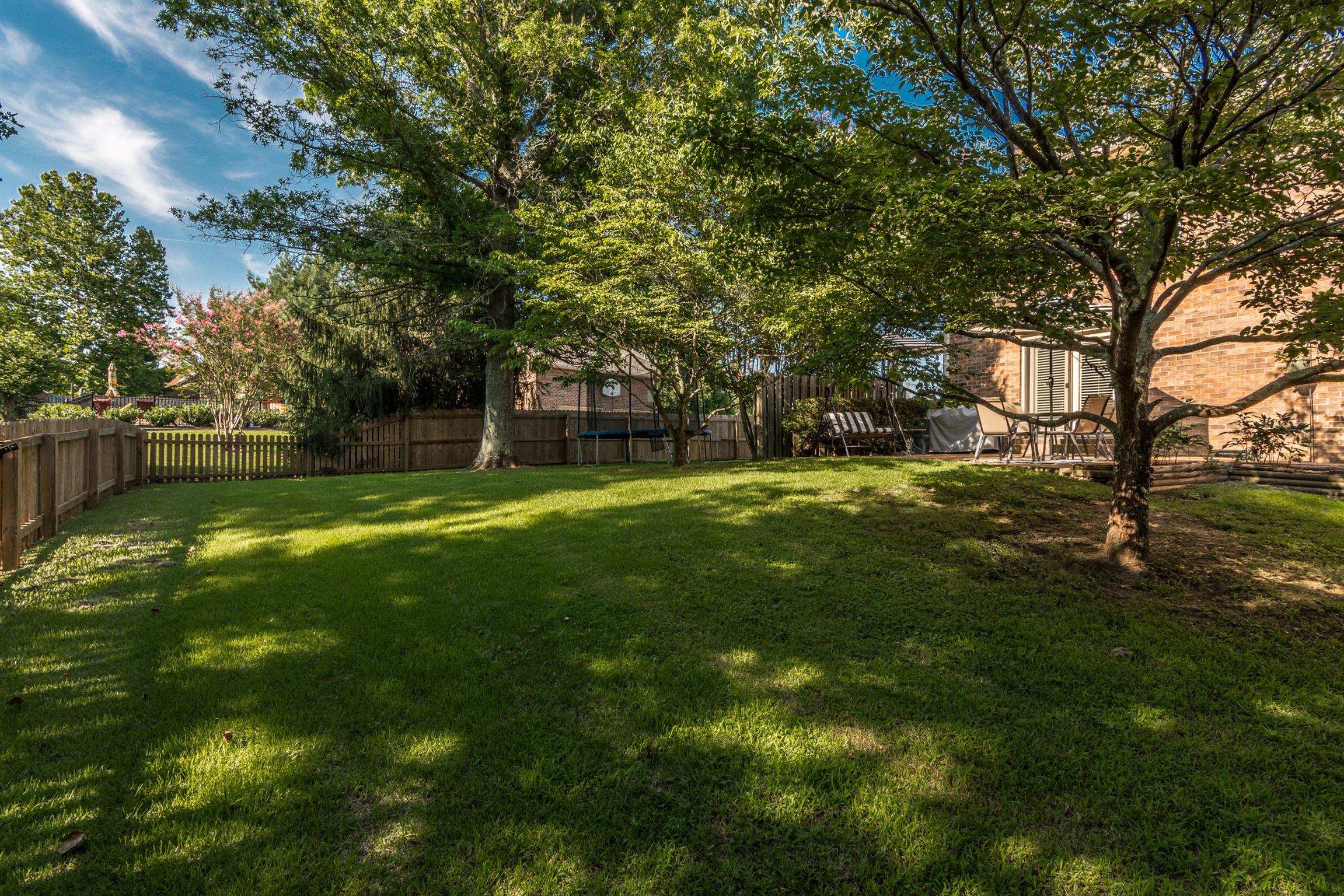 103 Crosspointe Hendersonville, TN 37075 - Photo 27 of 30 a backyard of a house with swimming pool and green space