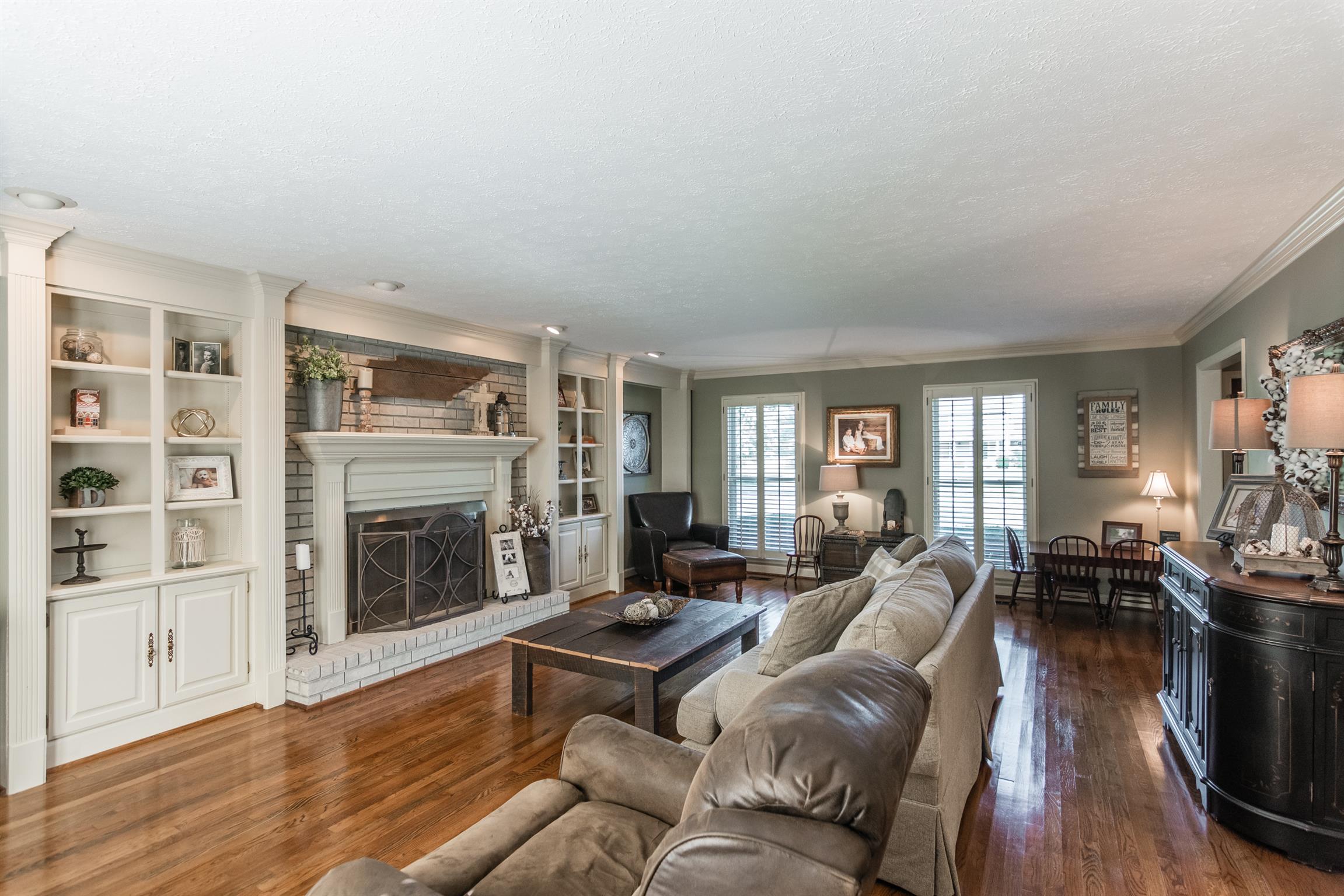 103 Crosspointe Hendersonville, TN 37075 - Photo 4 of 30 a living room with furniture flat screen tv and a fireplace