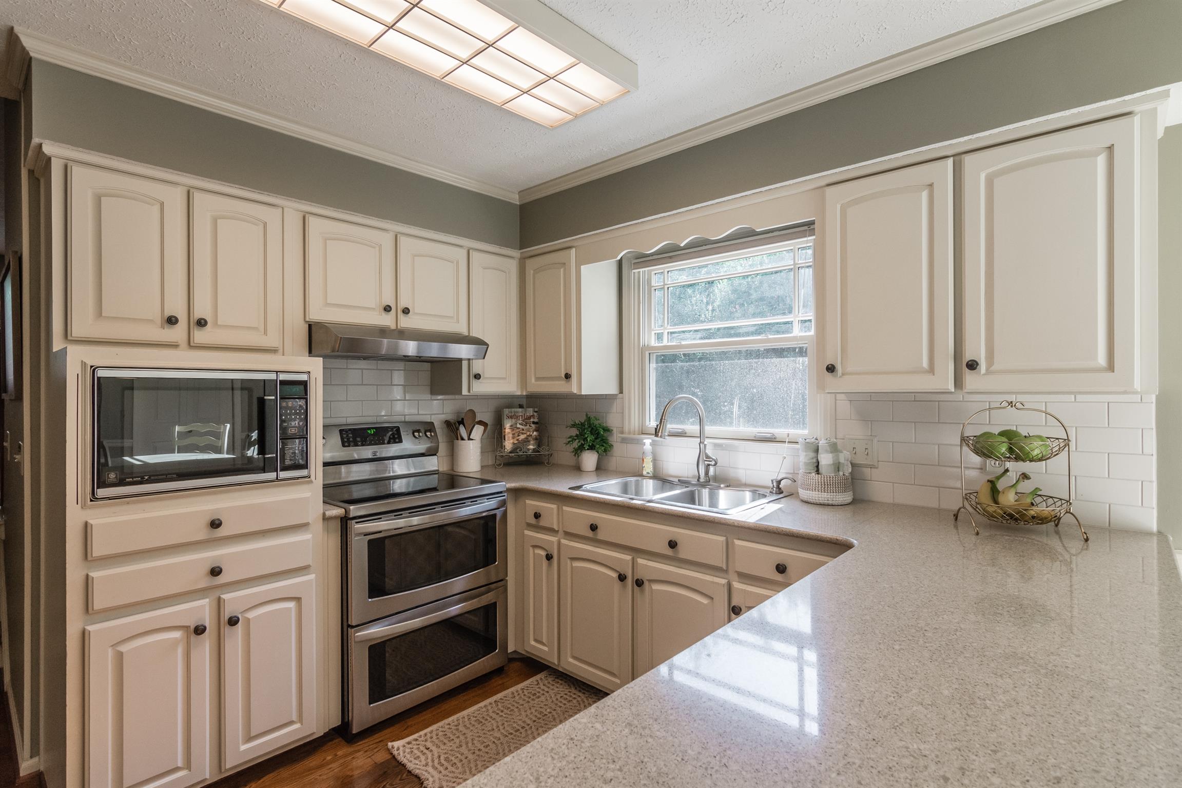 103 Crosspointe Hendersonville, TN 37075 - Photo 9 of 30 a kitchen with cabinets appliances a sink and a window