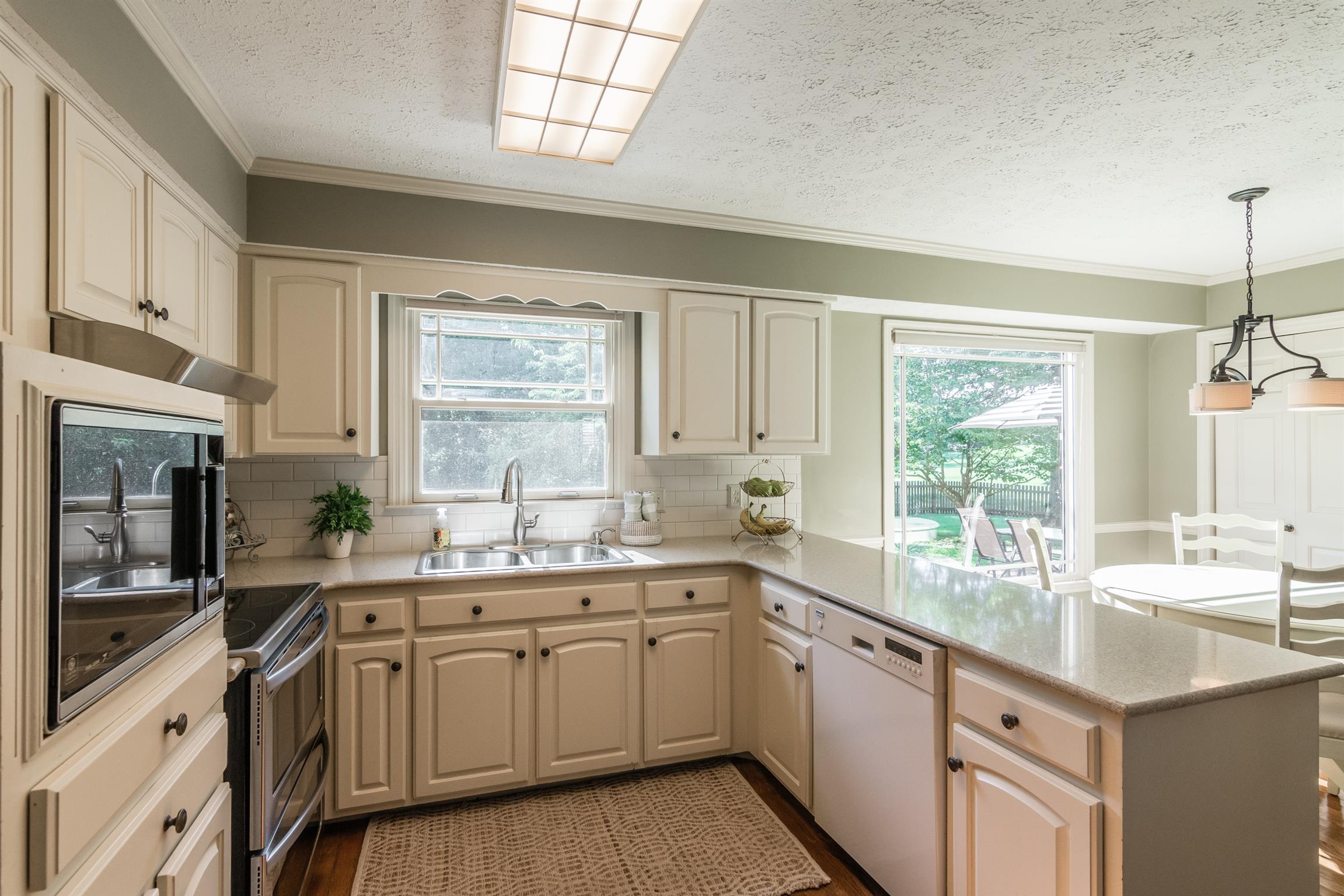 103 Crosspointe Hendersonville, TN 37075 - Photo 10 of 30 a kitchen with a sink cabinets appliances and a window