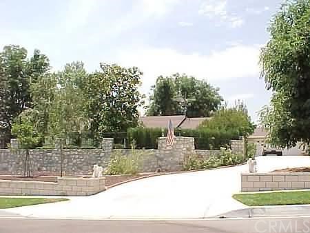 6166 Polo Place Rancho Cucamonga, CA 91739 - Photo 1 of 1 a view of a house with a yard