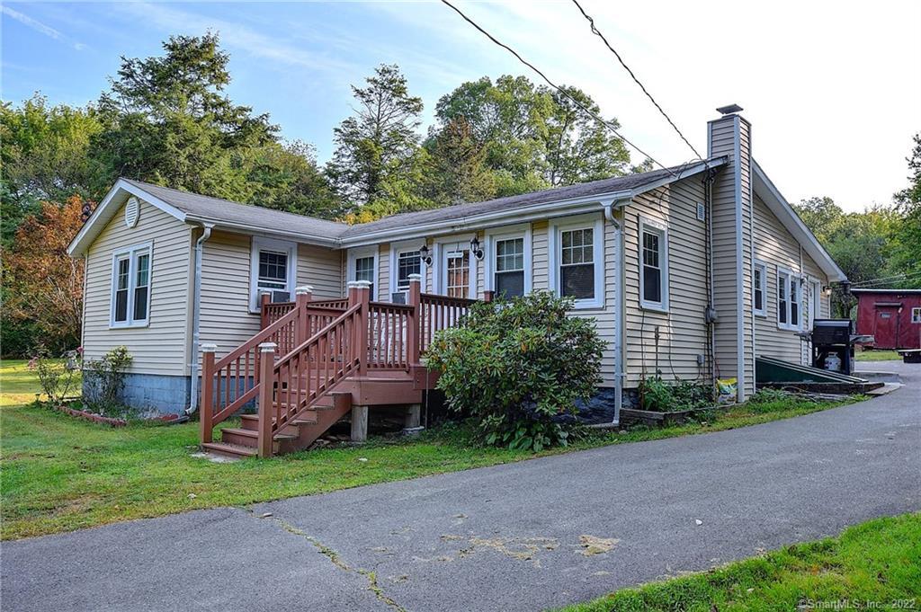 770 Cedar Swamp Road Coventry, CT 06238 - Photo 1 of 1 a view of a house with a yard and plants