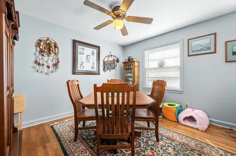 a dining room with furniture and window