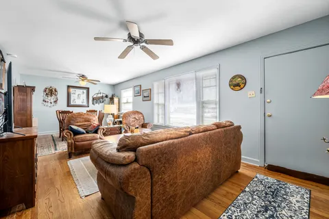 a living room with furniture and a window