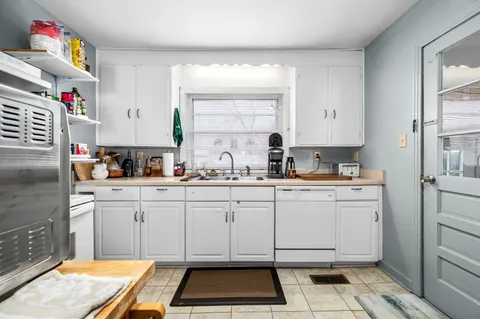 a kitchen with a cabinets and window