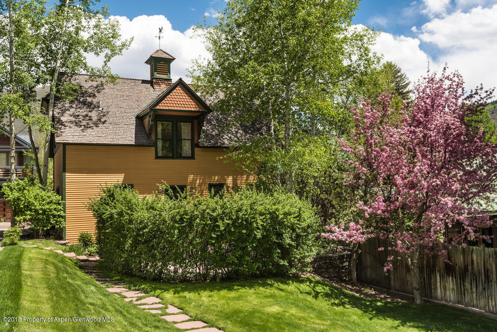 314 West Main Street Aspen, CO 81611 - Photo 1 of 20 a view of a house with a yard