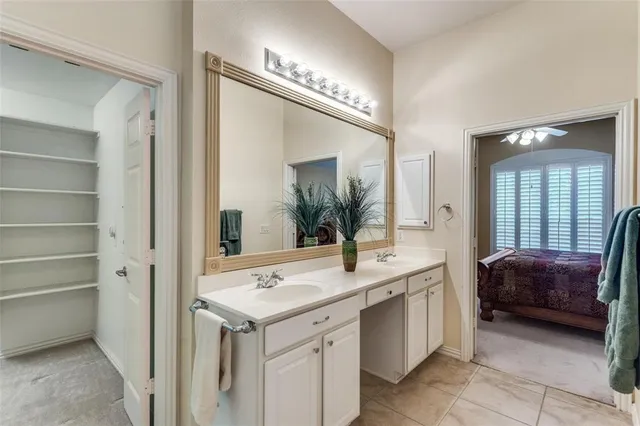 a en suite bathroom with a sink and a mirror