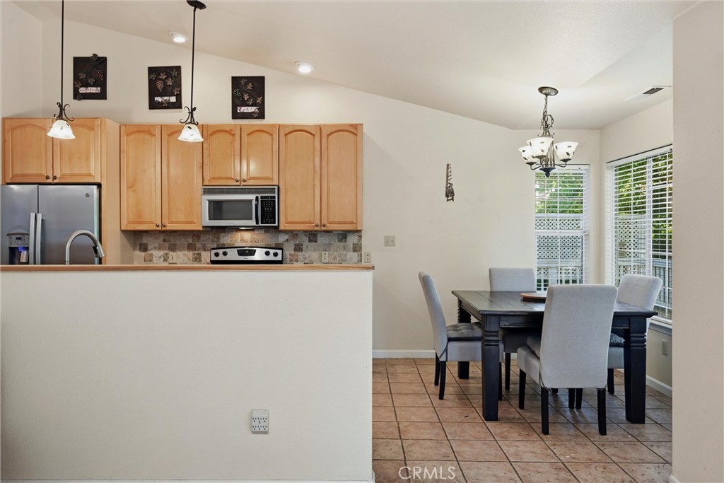 18846 Horseshoe Road Hidden Valley Lake, CA 95467 - Photo 7 of 31 a view of kitchen with furniture refrigerator and window