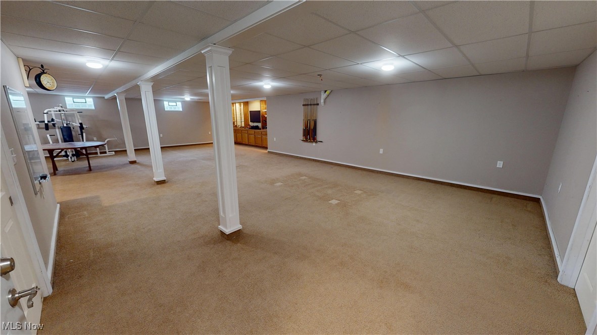 10323 Smith Road Litchfield, OH 44253 - Photo 33 of 50 Below grade area featuring baseboards, carpet flooring, and a paneled ceiling