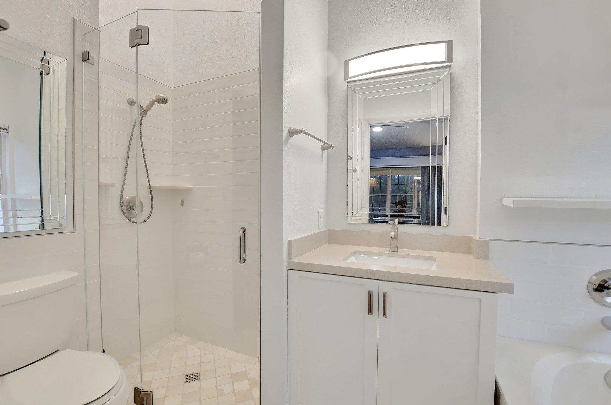 10230 Allegro Drive Boca Raton, FL 33428 - Photo 8 of 20 a bathroom with a sink toilet and shower