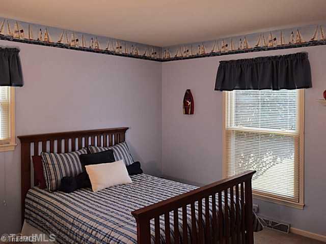 1708 Bolingbroke Road High Point, NC 27265 - Photo 11 of 16 2nd Bedroom. This corner bedroom has a big closet with a double folding door.
