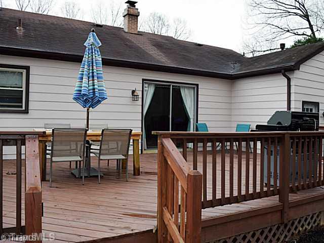 1708 Bolingbroke Road High Point, NC 27265 - Photo 14 of 16 Patio/Deck. A very large deck across the back of the home has room for seating, dining, grilling & more!