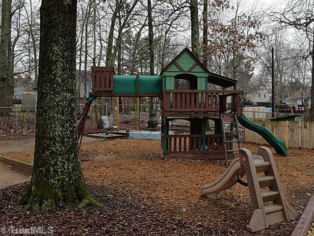 1708 Bolingbroke Road High Point, NC 27265 - Photo 15 of 16 Other. The big fenced backyard has a great play set as well as a second seating area with a swing.