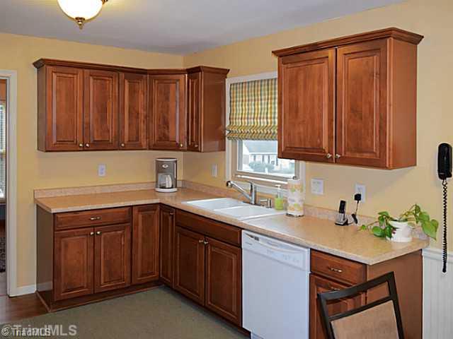 1708 Bolingbroke Road High Point, NC 27265 - Photo 6 of 16 Kitchen. The updated kitchen has new custom cabinets.