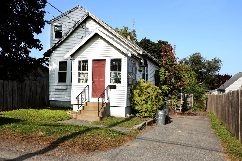 41 Echo Avenue Beverly, MA 01915 - Photo 2 of 24 a view of a small house in front of a house with plants and large tree
