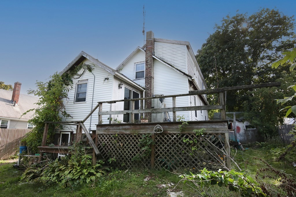 41 Echo Avenue Beverly, MA 01915 - Photo 3 of 24 a white house that has tree in front of it