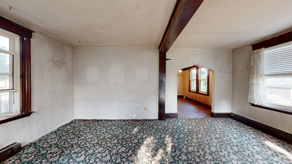 41 Echo Avenue Beverly, MA 01915 - Photo 9 of 24 a view of a livingroom with wooden floor and a window