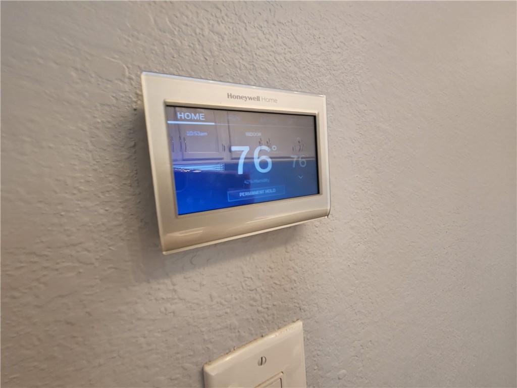 2815 Rio Grande Street, Unit 215 Austin, TX 78705 - Photo 8 of 11 Modern digital thermostat for optimized climate control.
