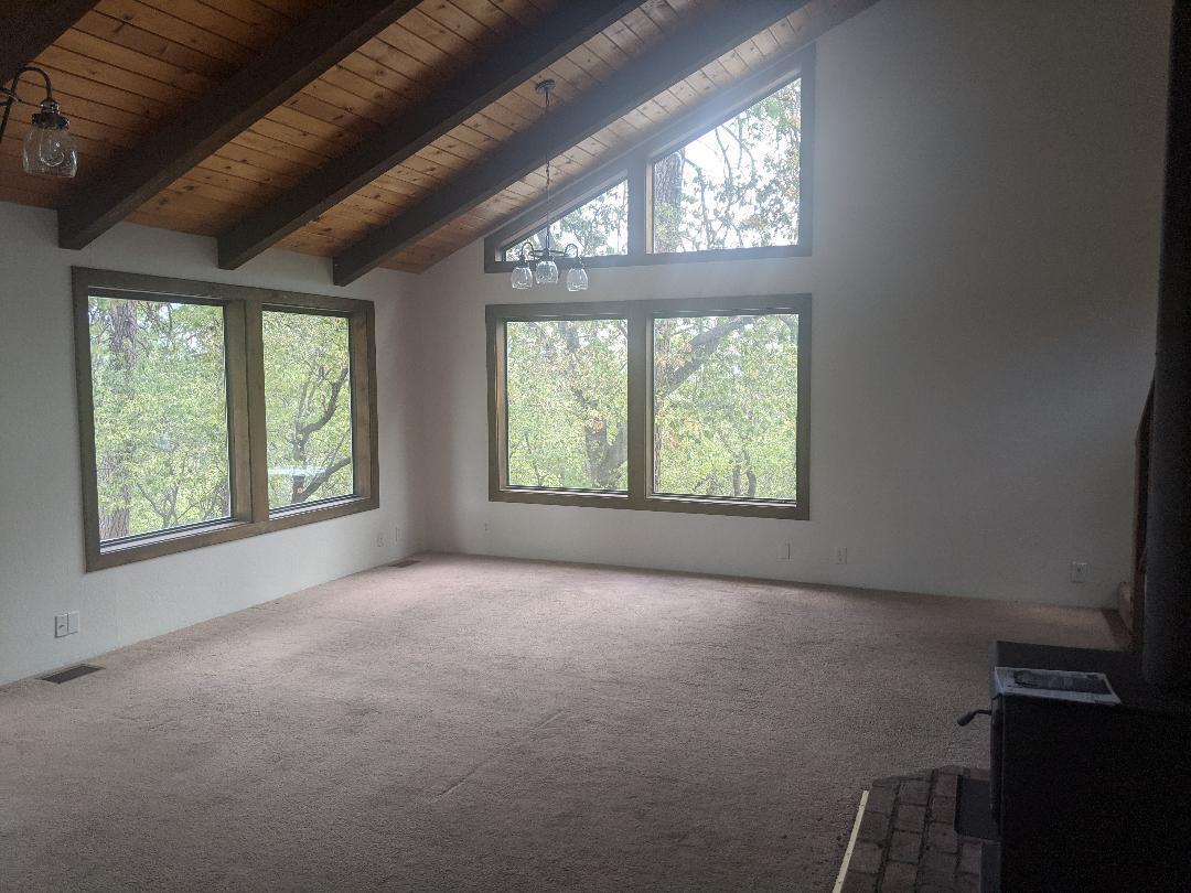 12877 Bobs Mountain Road Redding, CA 96003 - Photo 11 of 51 an empty room with windows