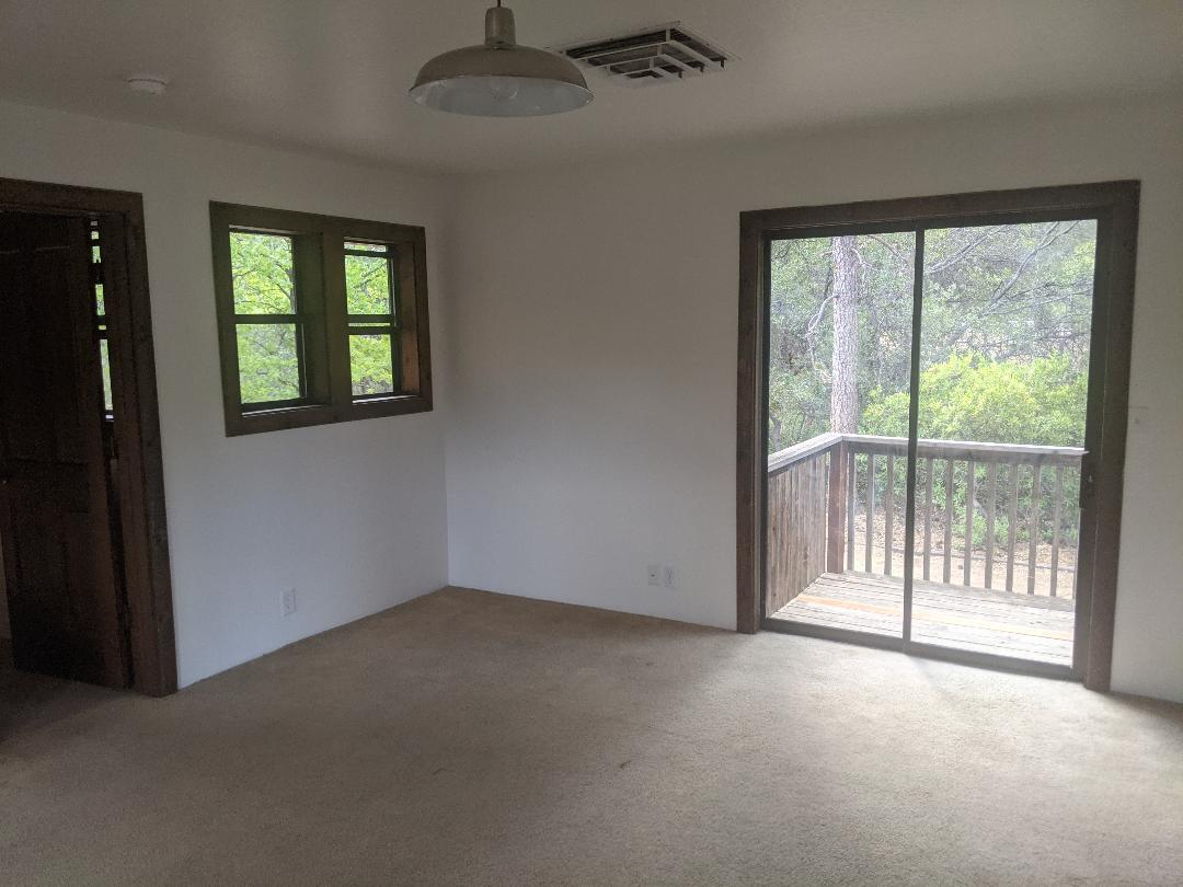 12877 Bobs Mountain Road Redding, CA 96003 - Photo 15 of 51 an empty room with windows