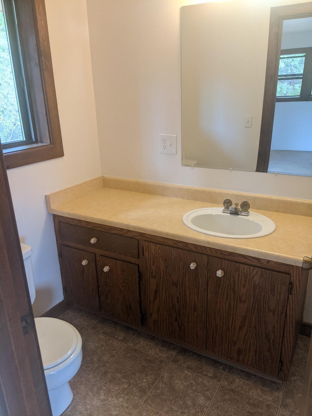 12877 Bobs Mountain Road Redding, CA 96003 - Photo 17 of 51 a bathroom with a sink vanity granite and toilet