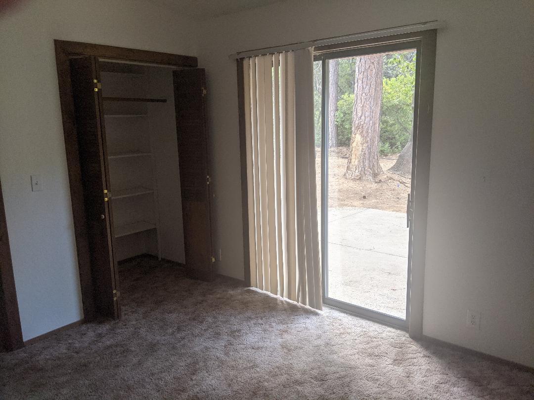12877 Bobs Mountain Road Redding, CA 96003 - Photo 19 of 51 an empty room with windows