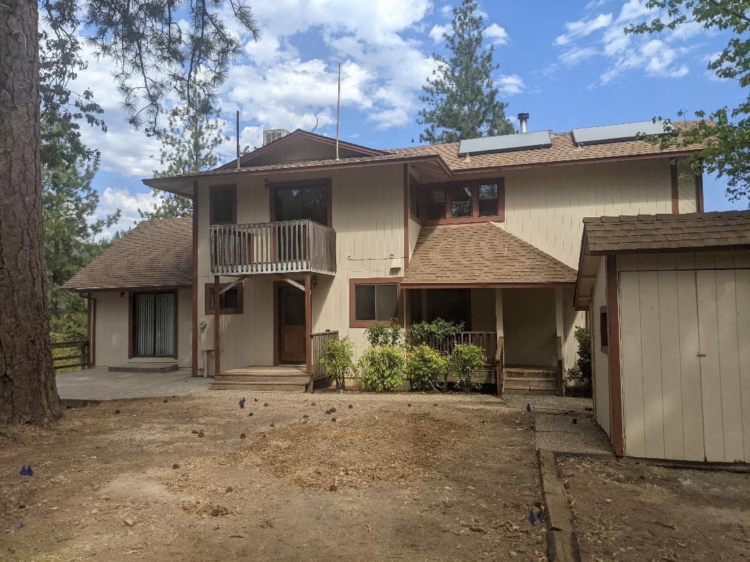 12877 Bobs Mountain Road Redding, CA 96003 - Photo 3 of 51 front view of a house with a yard