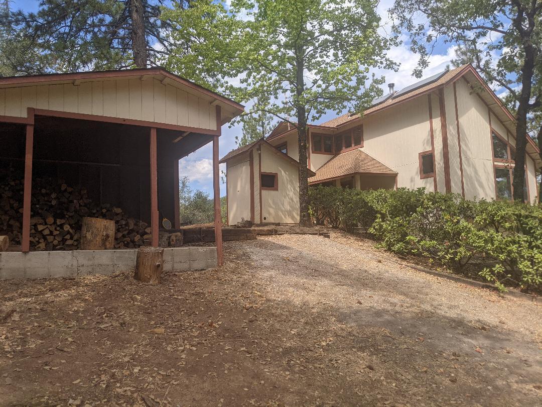 12877 Bobs Mountain Road Redding, CA 96003 - Photo 41 of 51 a view of a house with a yard and tree