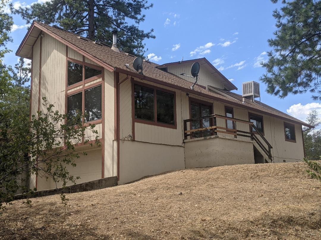 12877 Bobs Mountain Road Redding, CA 96003 - Photo 5 of 51 a house view with a backyard space