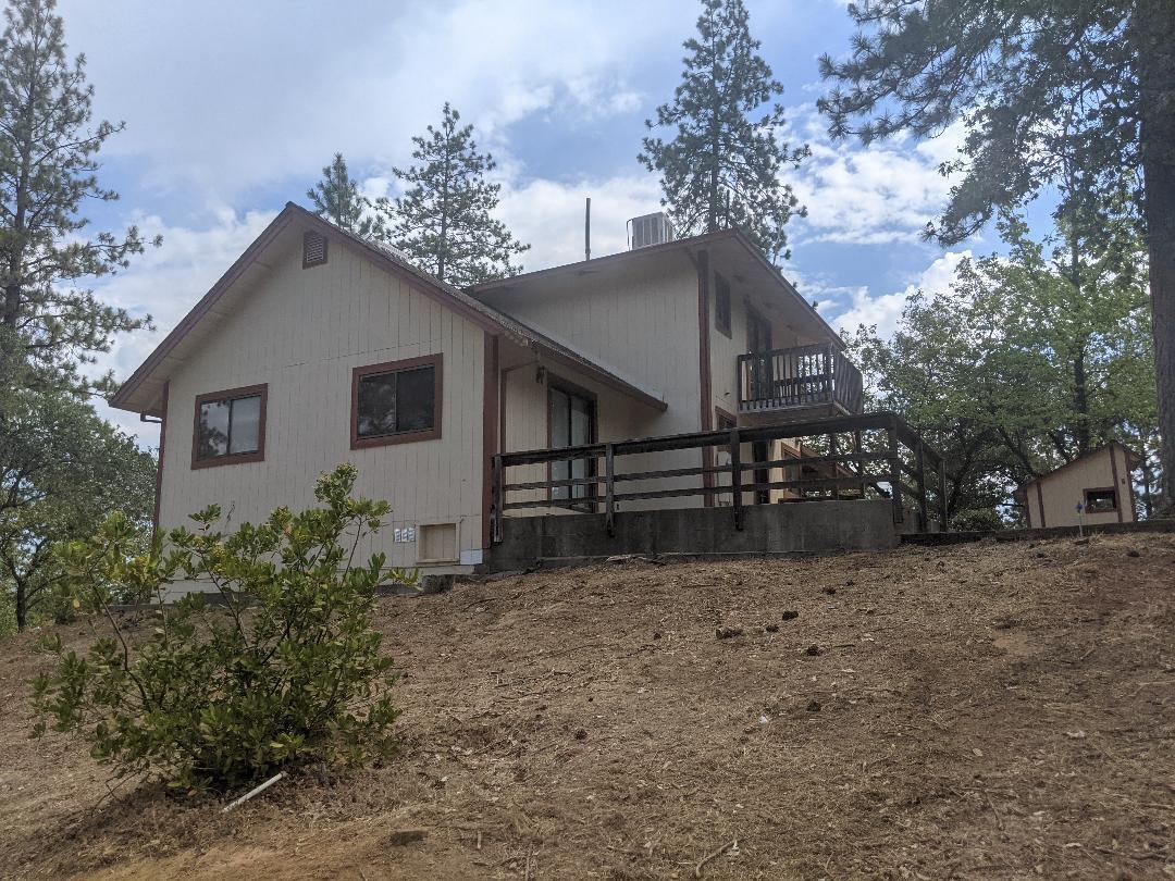 12877 Bobs Mountain Road Redding, CA 96003 - Photo 7 of 51 a view of a house with a yard