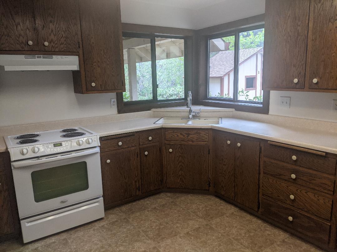 12877 Bobs Mountain Road Redding, CA 96003 - Photo 9 of 51 a kitchen with a stove sink and window